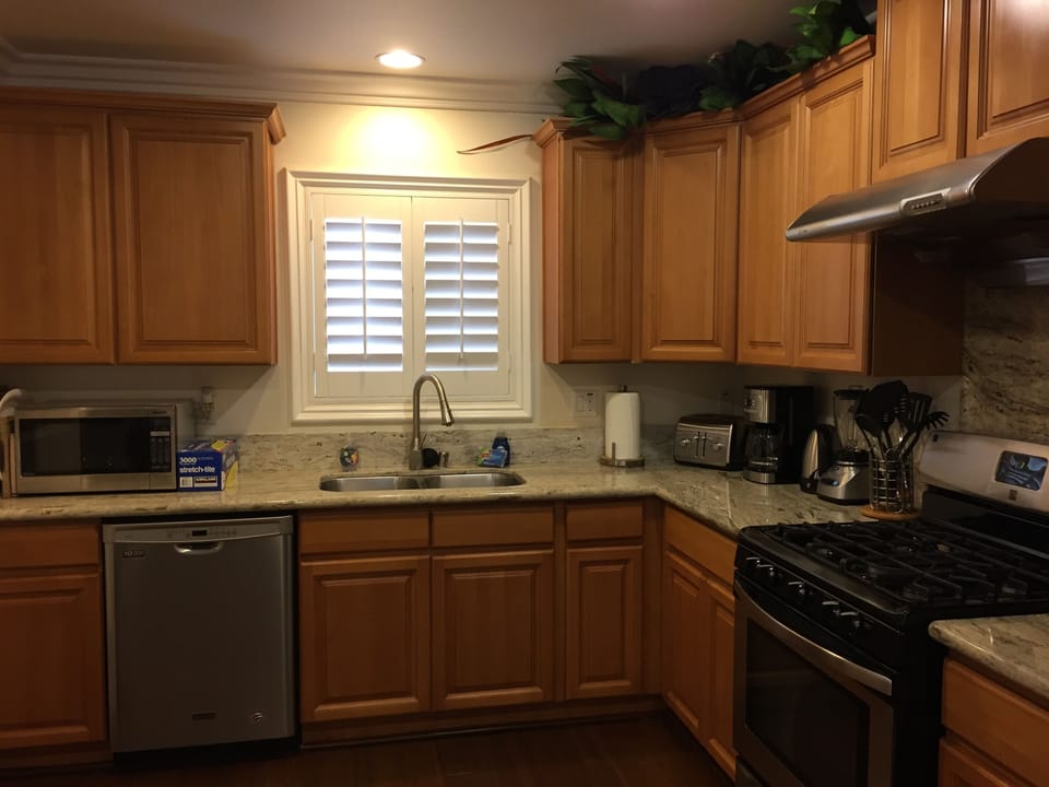 Plates/Glass/Silver/Pans/Salt/Sugar/Trash Bags/Detergent at kitchen cabinets