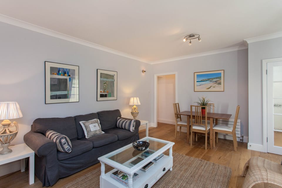 Beautiful spacious living room decorated to a high standard with dining table