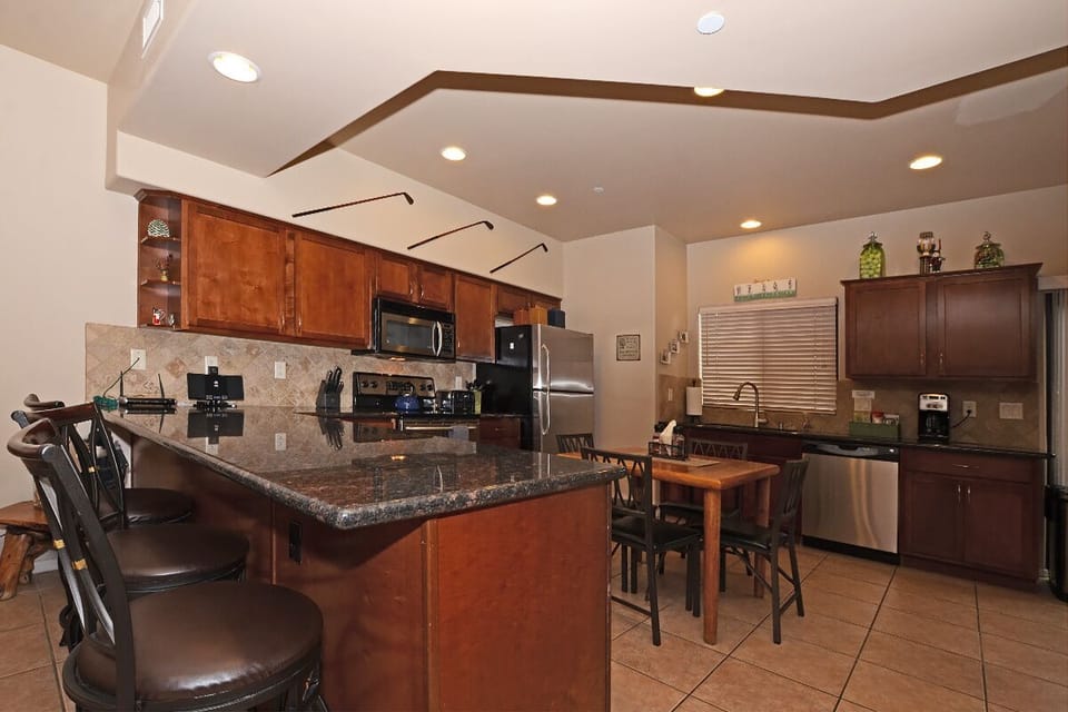 Kitchen with  Granite Counter tops and 3 Counter Bar Stools