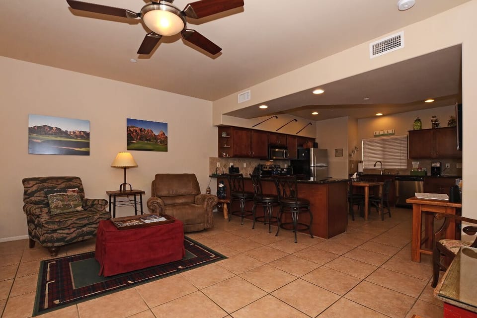 Living Room with Kitchen  separated by Counter with 3 Bar Stools