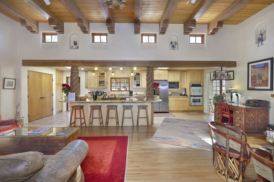 Looking from very large great room to fully equipped Kitchen. Large work desk.