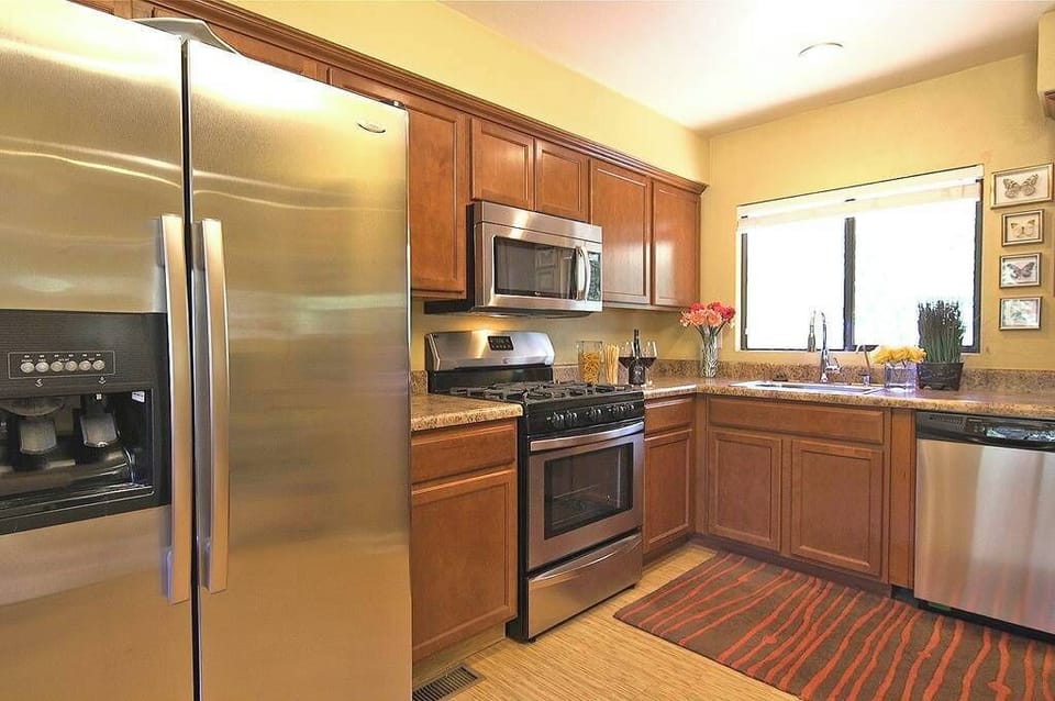 Fully equipped kitchen features all new stainless steel appliances.