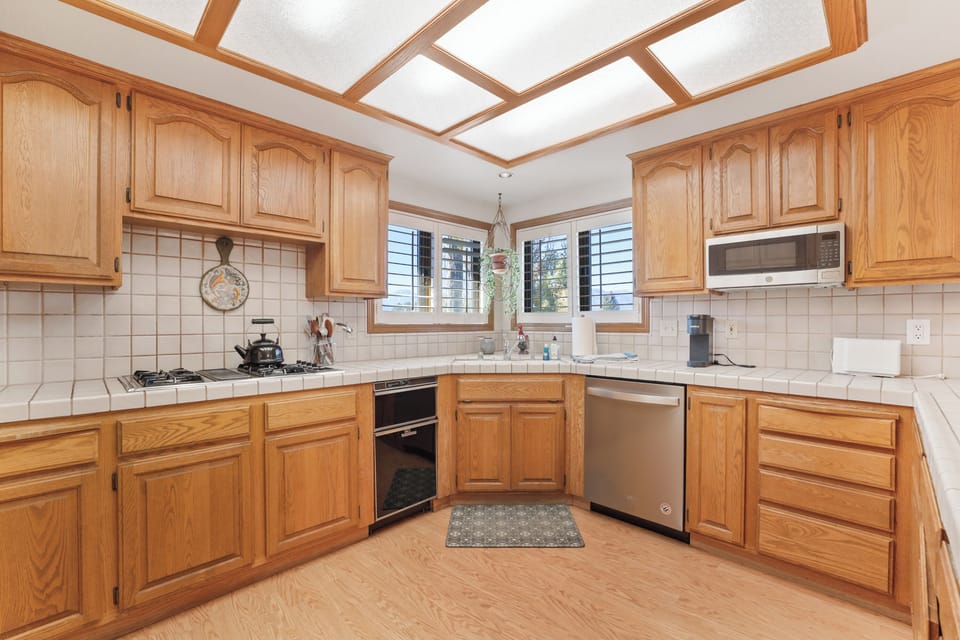 Full Kitchen with everything youll need for  meals, new cookware, flatwear, etc