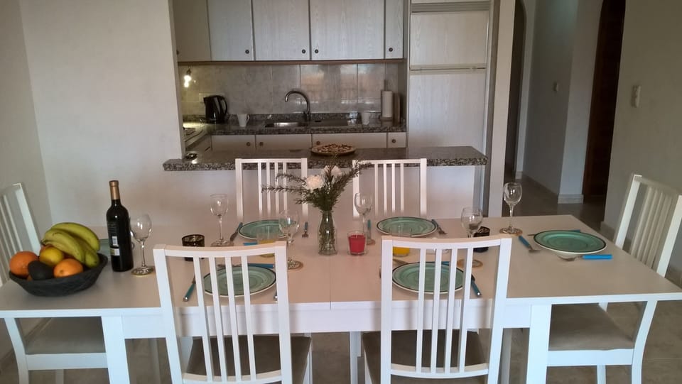 The dining area with kitchen beyond (fully equipped including dishwasher)