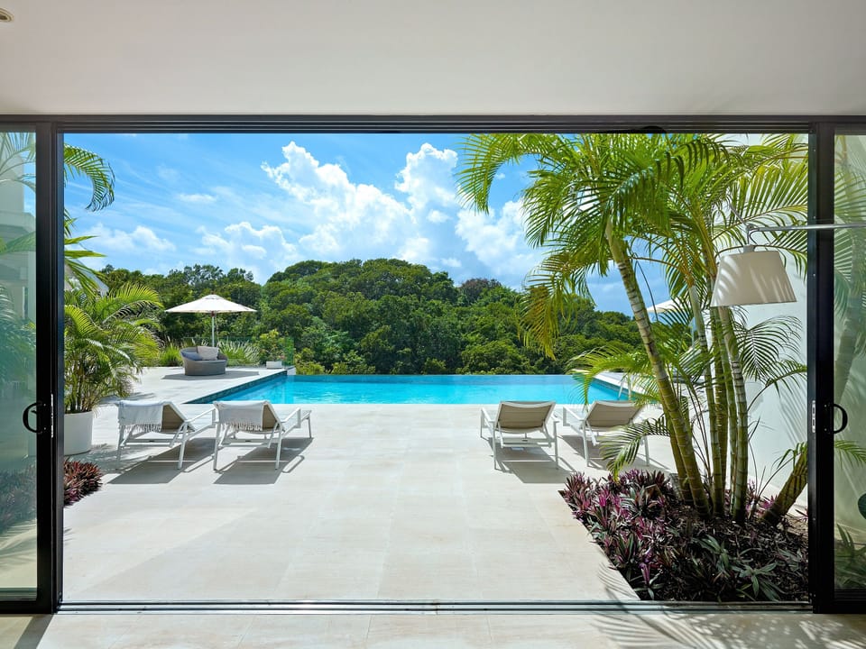 Entrance hall with inviting pool view