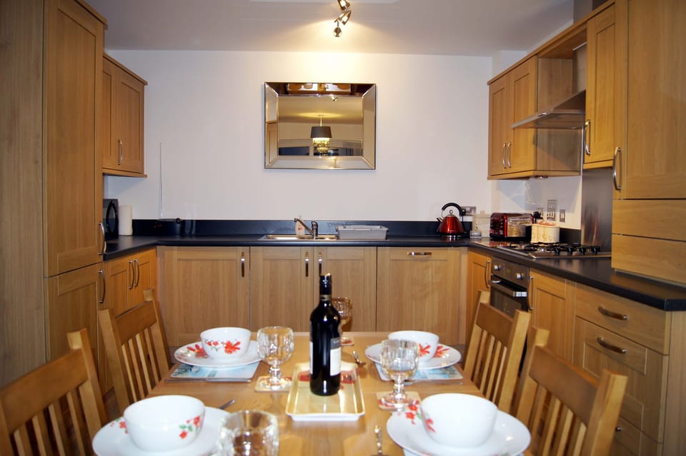 Dinning Table and Fully Equipped Modern Kitchen