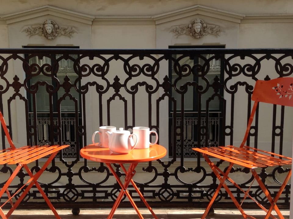 One of the three balconies facing historical buildings