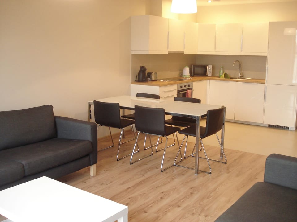 Modern kitchen with dishwasher, washing machine, hob, oven, fridge-freezer 