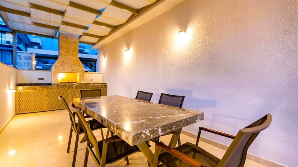 Outdoor kitchen and dining terrace.