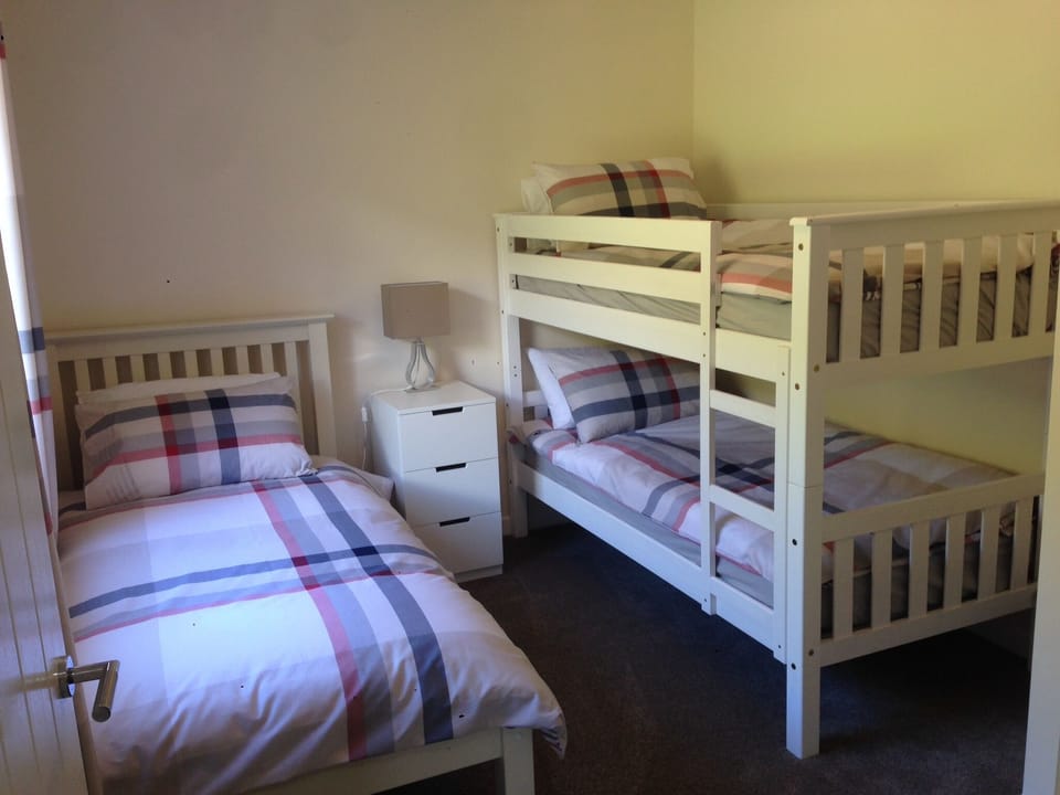 Second bedroom with comfortable single and bunk beds