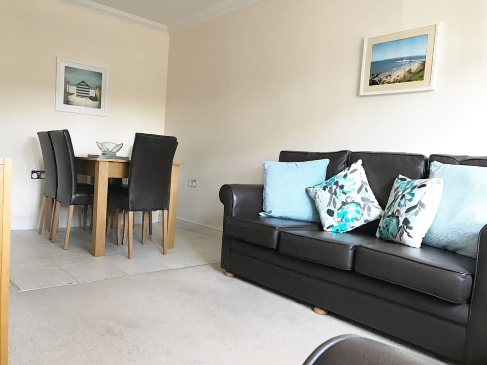 spacious living area with entertainment unit TV, DVD player, books, games & dvd'