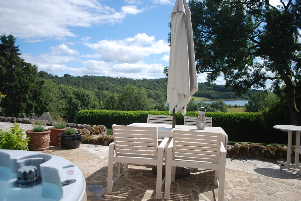 Hot tubs hired in, with amazing lake views from the terrace.