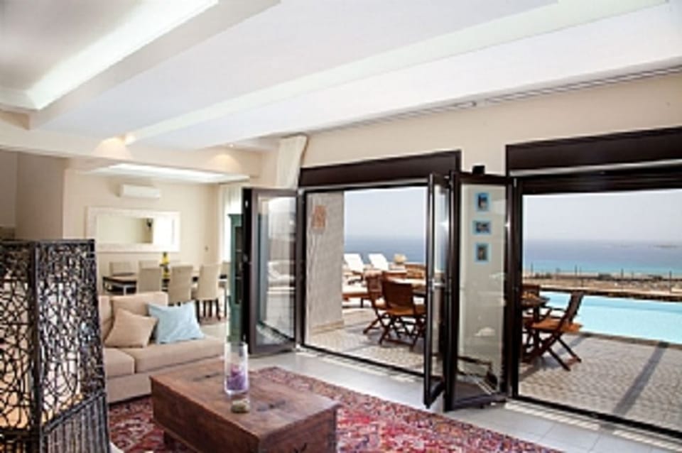 Living area opening to outdoor dining