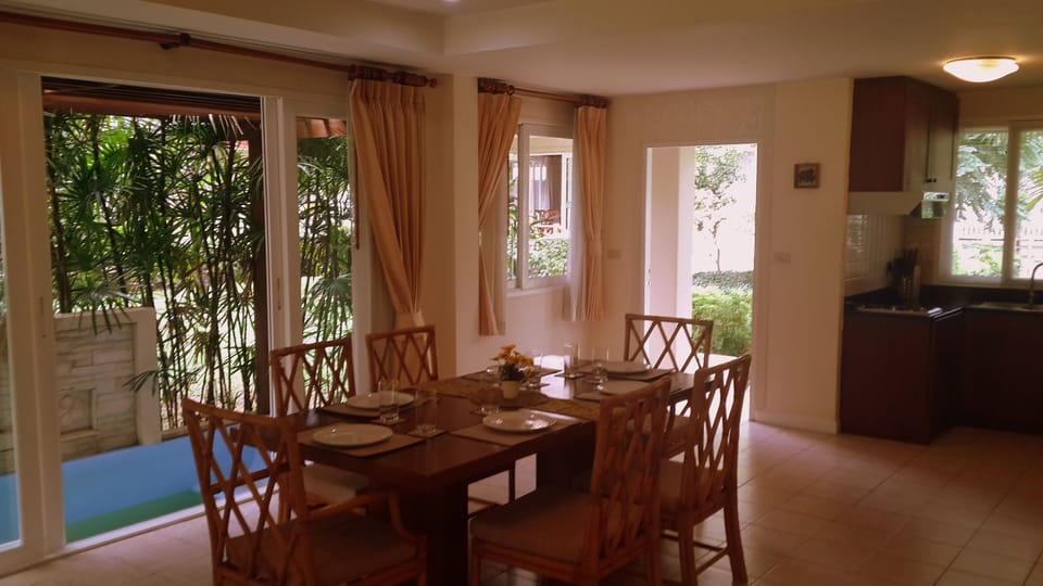 Dining area with spa in background