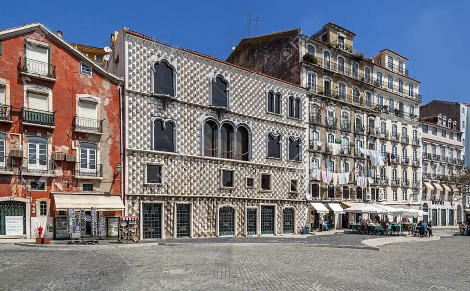 image of the building  from the square ( yellow building on the right side