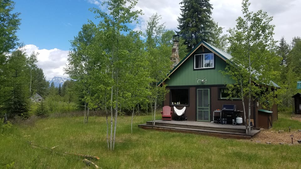 Lovely front porch for grilling and relaxing in the western exposure...