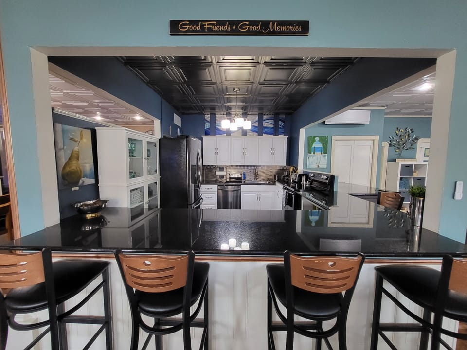 Black stainless steel appliances & black granite counter tops and flooring