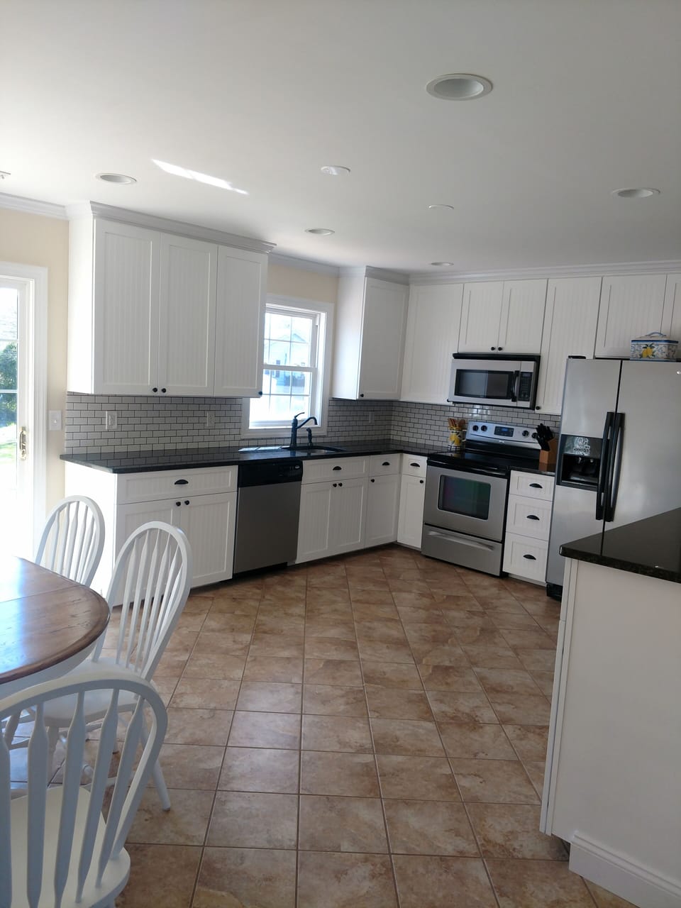 Huge open kitchen, granite countertops, stainless appliances, and ready to cook.