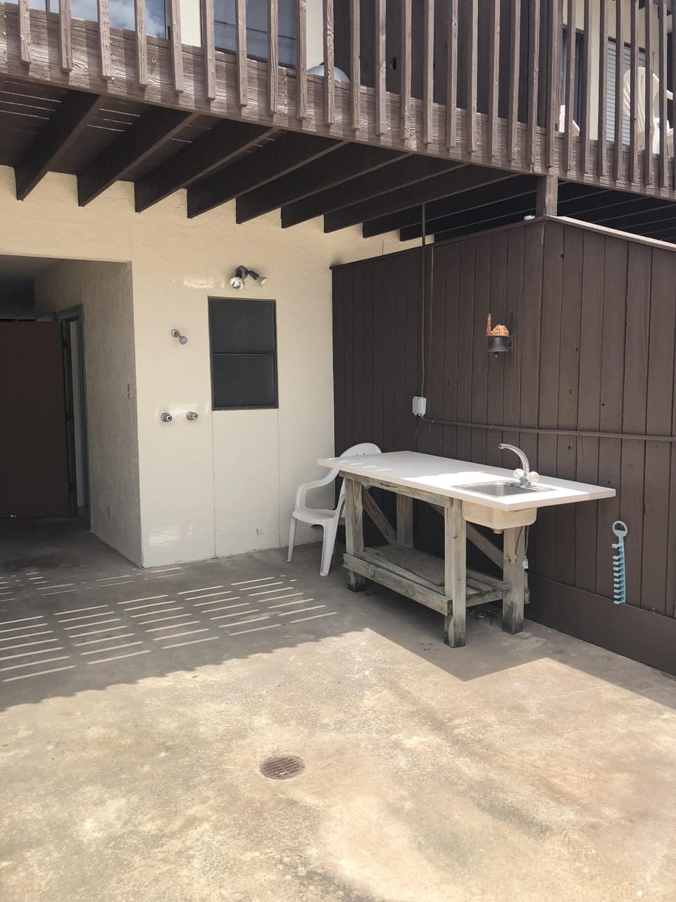 Fish cleaning table and outdoor shower