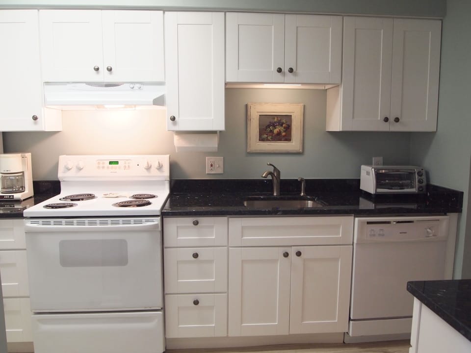 Fully equipped kitchen with coffee maker, toaster oven & full size dishwasher.