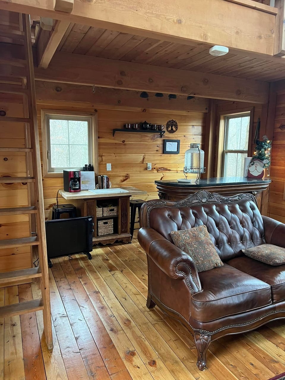 ship ladder to upstairs loft
Kitchenette behind bar with mini fridge and stove