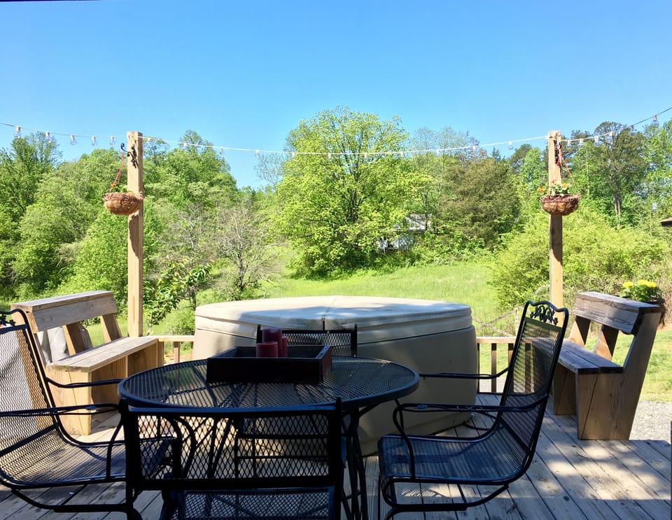Outdoor table and two person hot tub.
