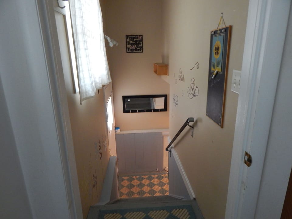 Entrance to basement (lower level rec room & laundry room)
