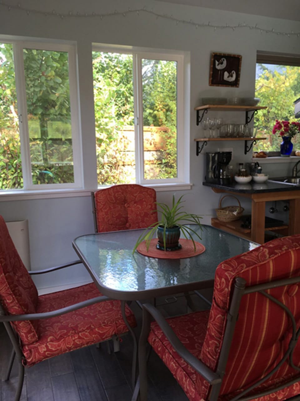 Dining area is surrounded by windows..doors lead out to deck and backyard.