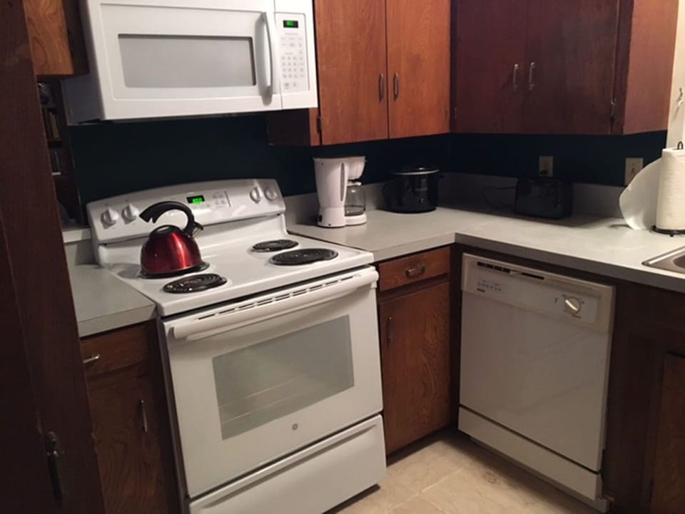 kitchen microwave, oven and dishwasher 
