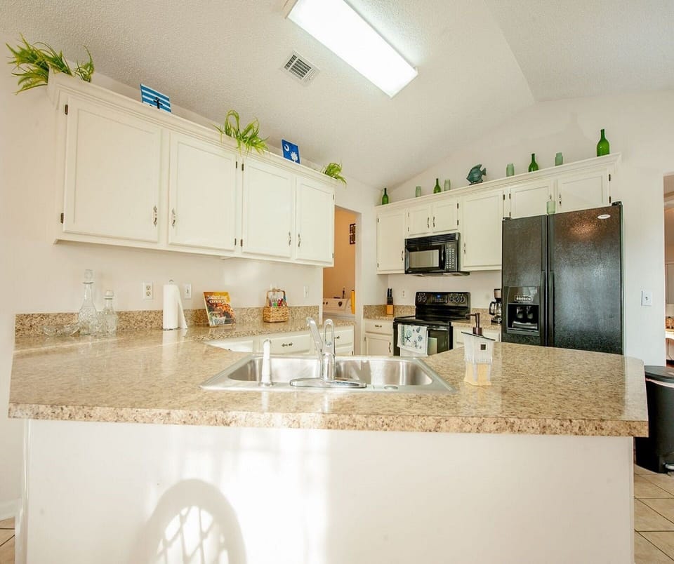 Spacious and open kitchen is stocked to prepare delicious meals