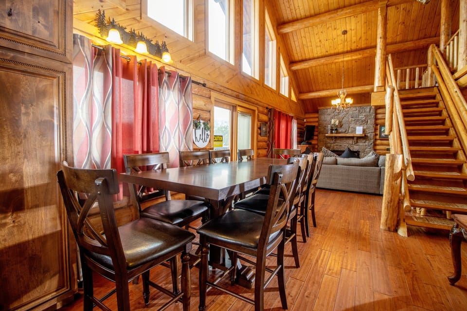 Dining area next to the kitchen with seating for 10 guests and mountain views.