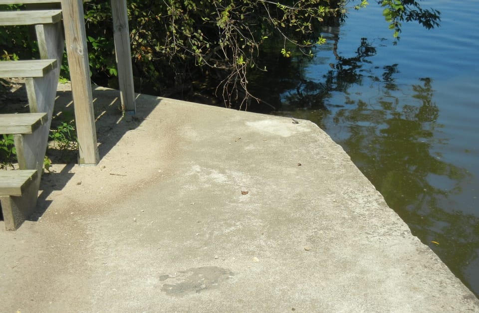 We have a small cement dock at the water's edge.  It's 42 steps down from patio.