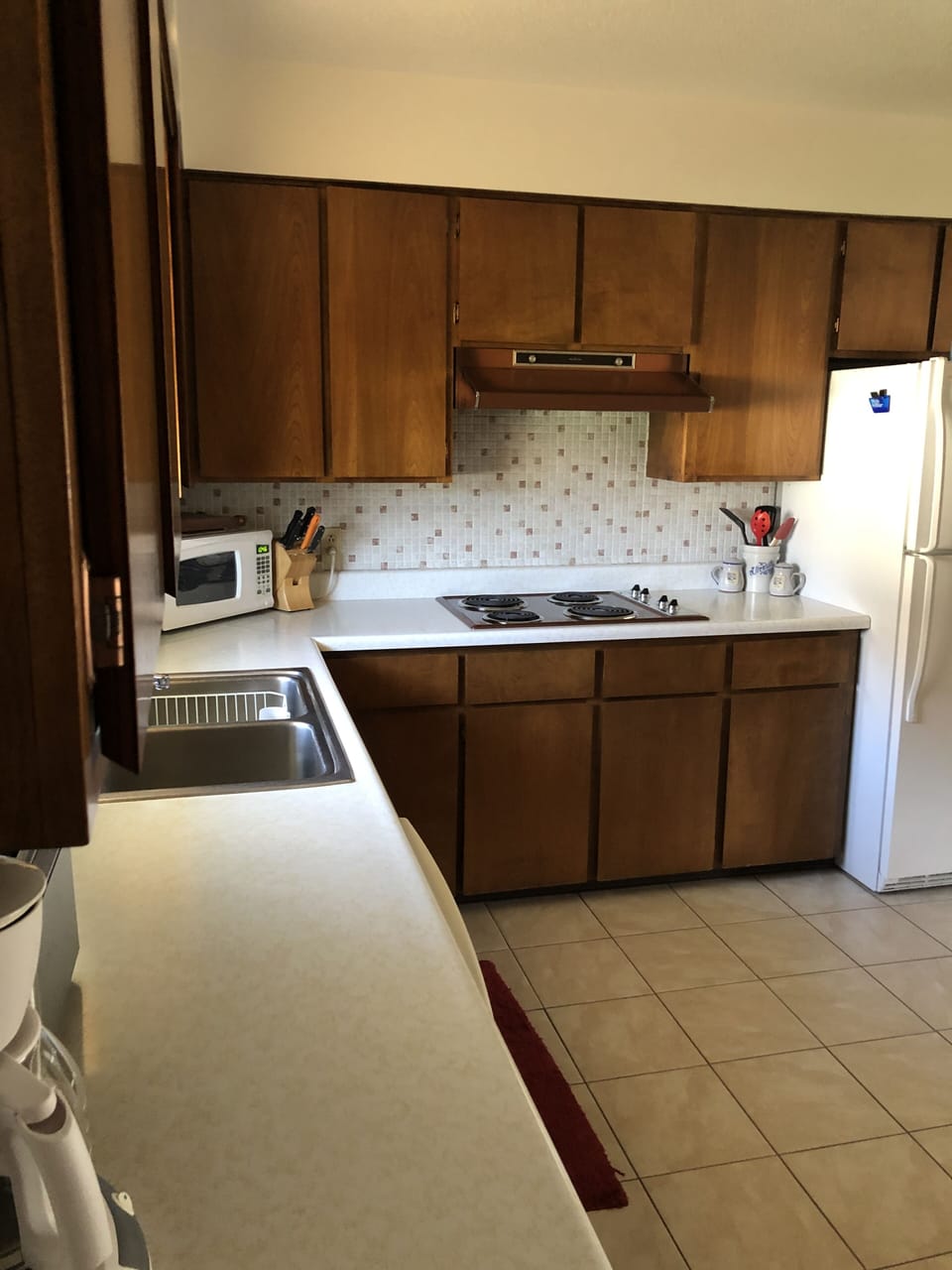 Kitchen.  Refrigerator has an ice maker.