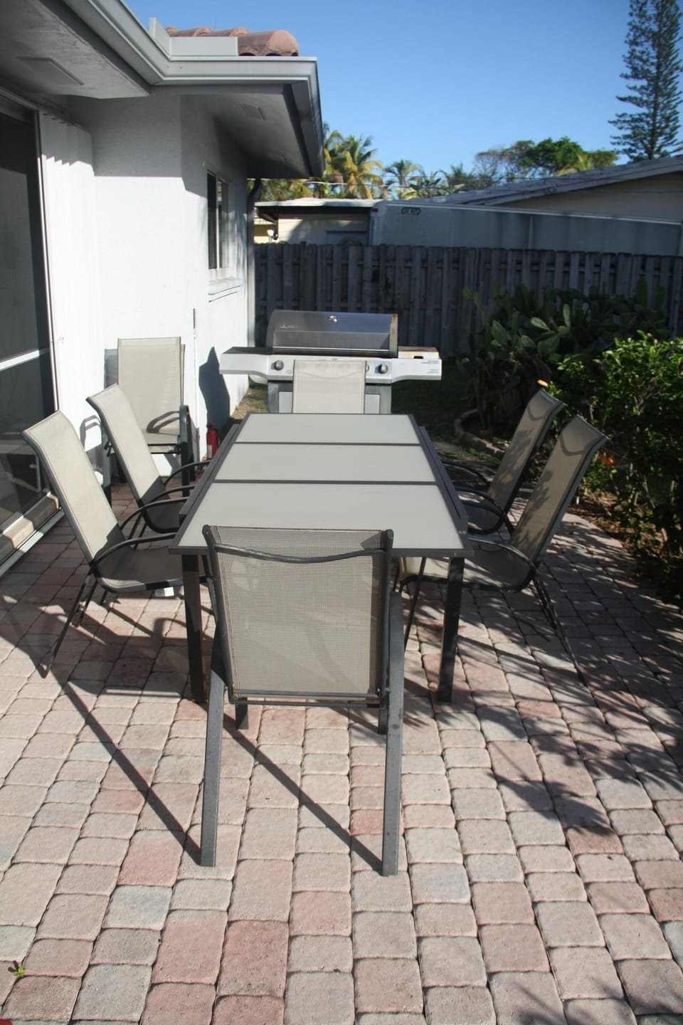 Outdoor dining area with gril