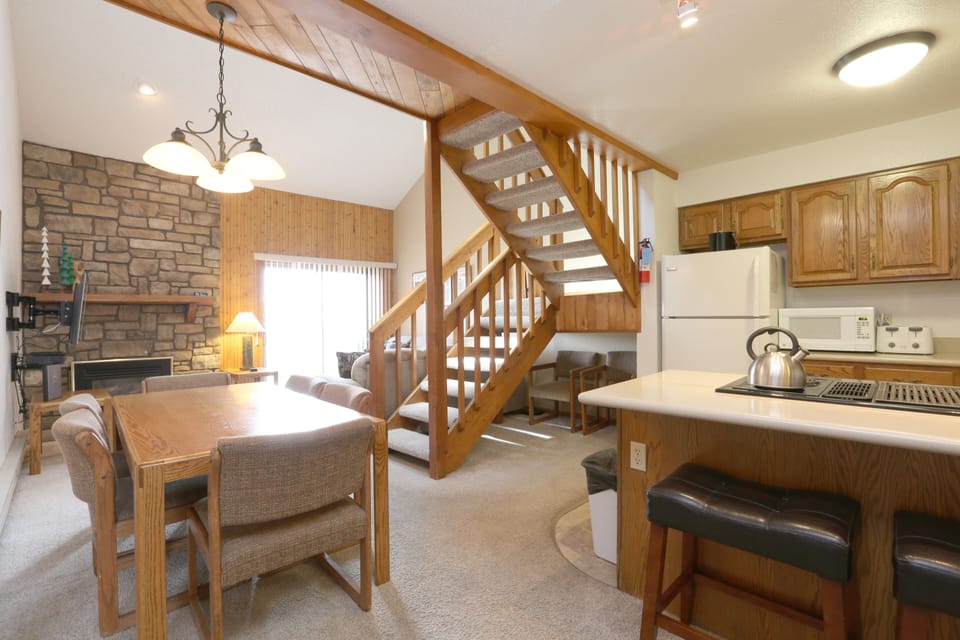 View of Open Floor Plan with View of Stairs to Loft