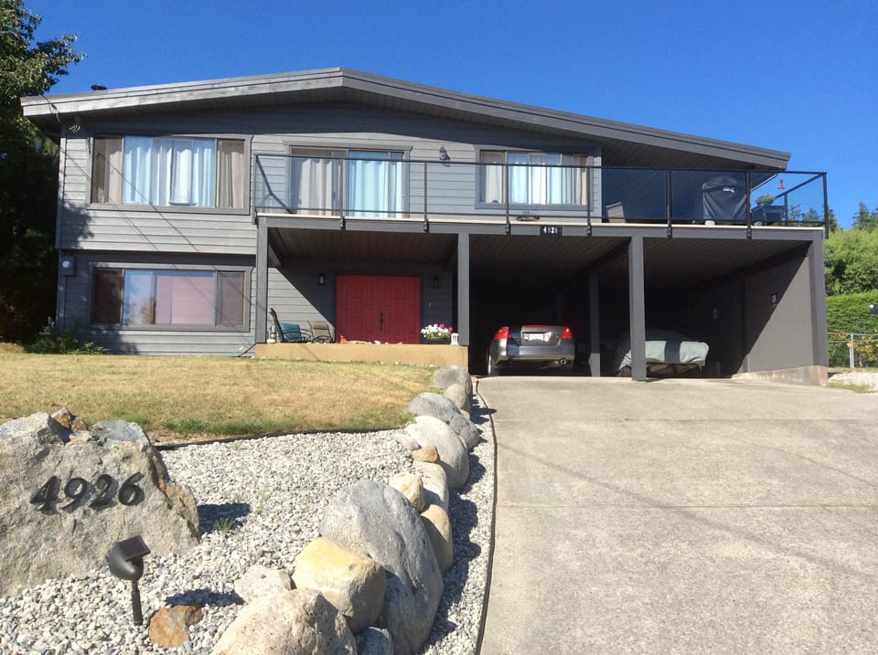 Our home 4926 Laurel Ave/parking in the carport/side door entry/endless sunshine