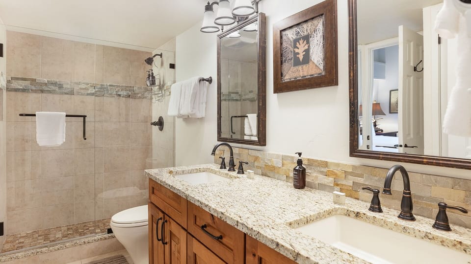 Relax in your spa-inspired bathroom with a spacious walk-in shower, elegant granite countertops, and double vanities. Fresh towels await after your mountain adventures.