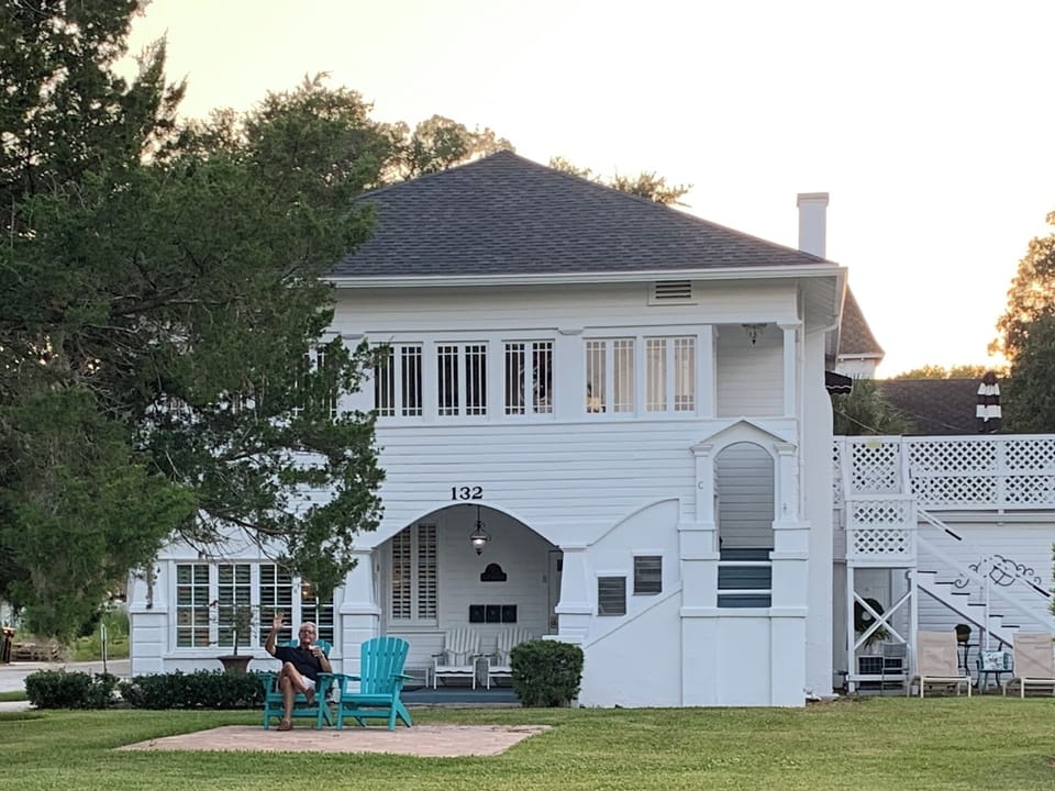 Front of 132 San Marco showing the patio and Adirondack chairs