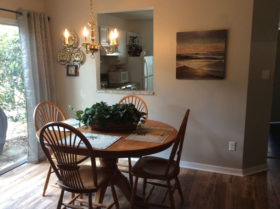 Six can dine with two extra chairs and table insert.