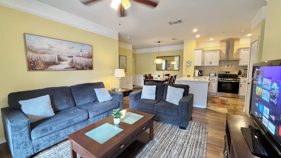 Living Room with 55" Flat Screen Roku Tv and Ceiling Fan !