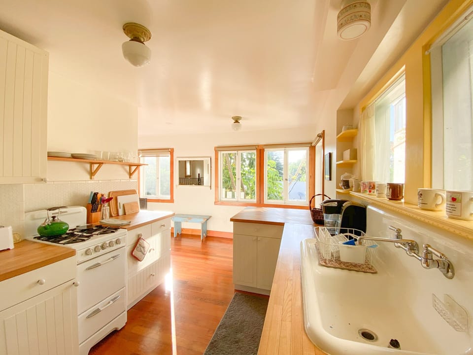 View of the kitchen from the entrance. The open floor plan invites you in.
