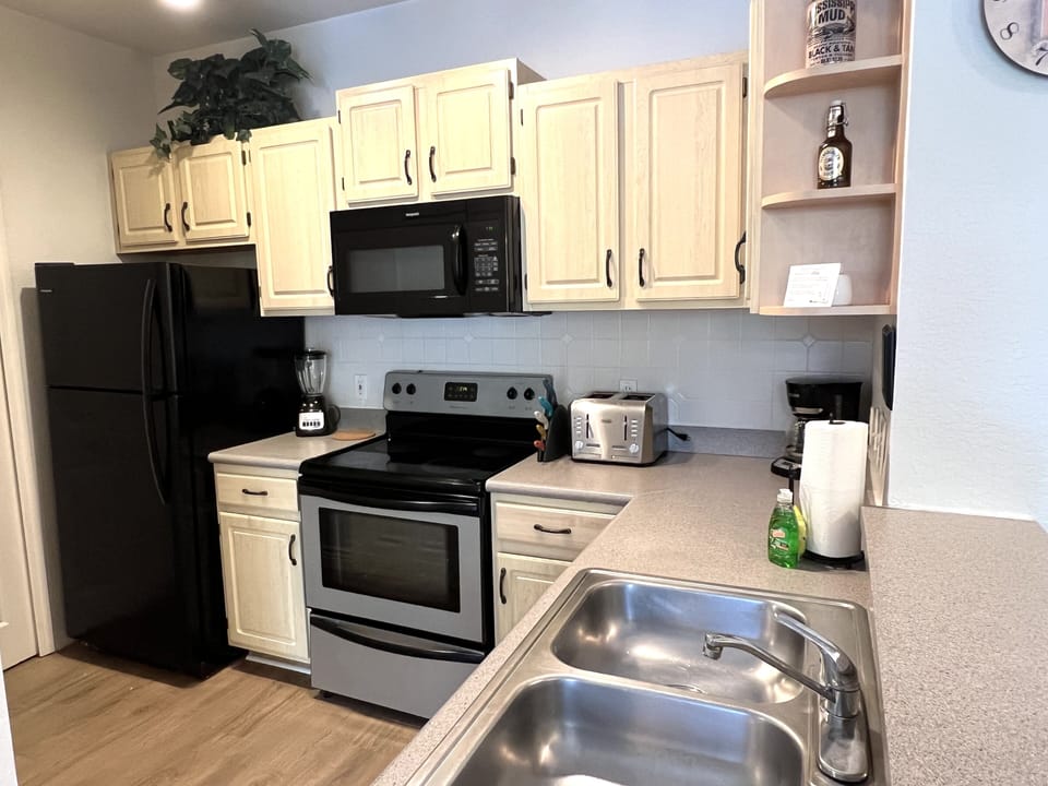 Microwave, Stove, Coffee Maker, Toaster, Pots, Pans, Dishes and so much more...