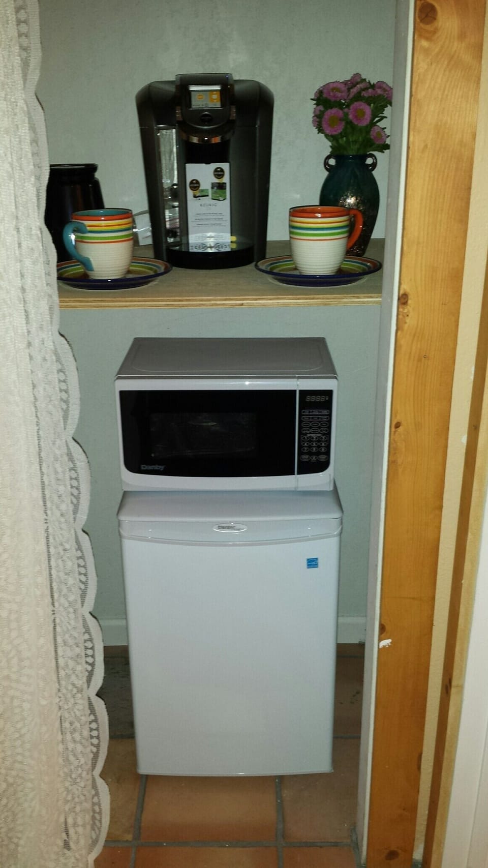 In-room.  Small fridge, microwave, kuerig. 