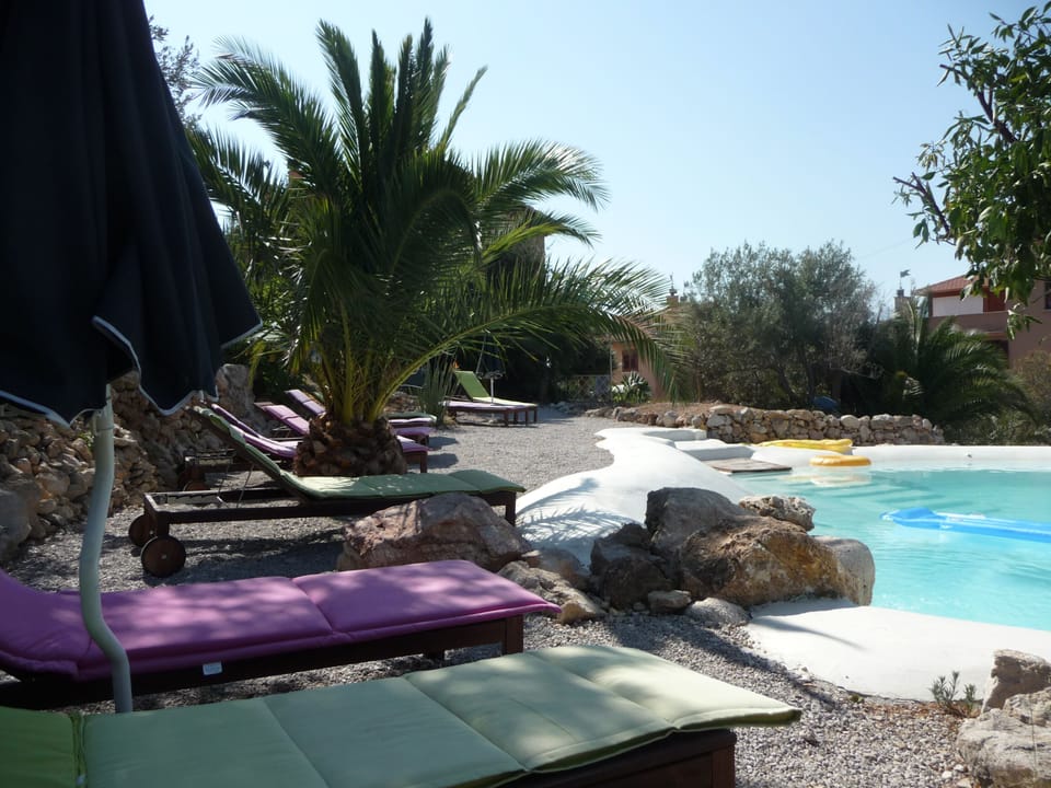 Natural lake-shaped pool in the middle of a Mediterranean garden with great view