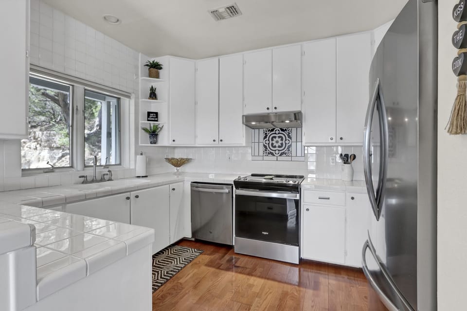 Full kitchen with stainless steel appliances