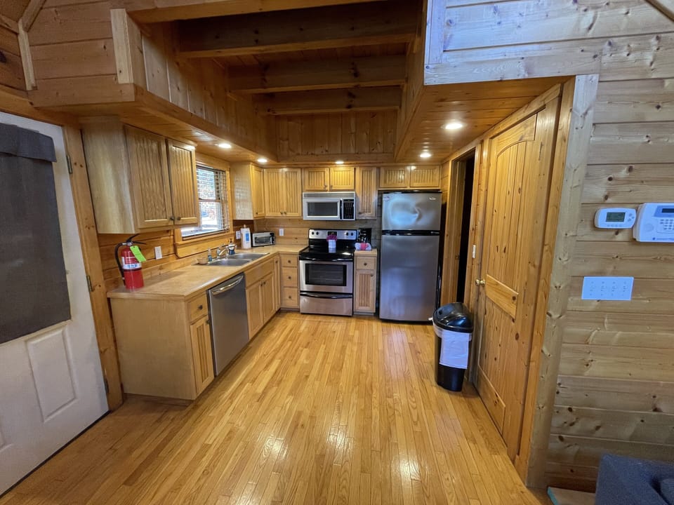 Full kitchen. Washer/Dryer off kitchen, enclosed. Great for long stays! 