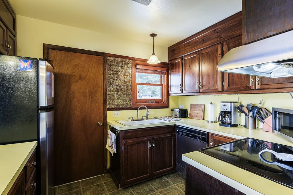 Gorgeous original restored wood cabinets in the kitchen.
