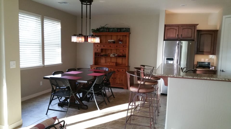 Dining table seats 6 plus 3 can seat at bar. Patio has seating for 4.