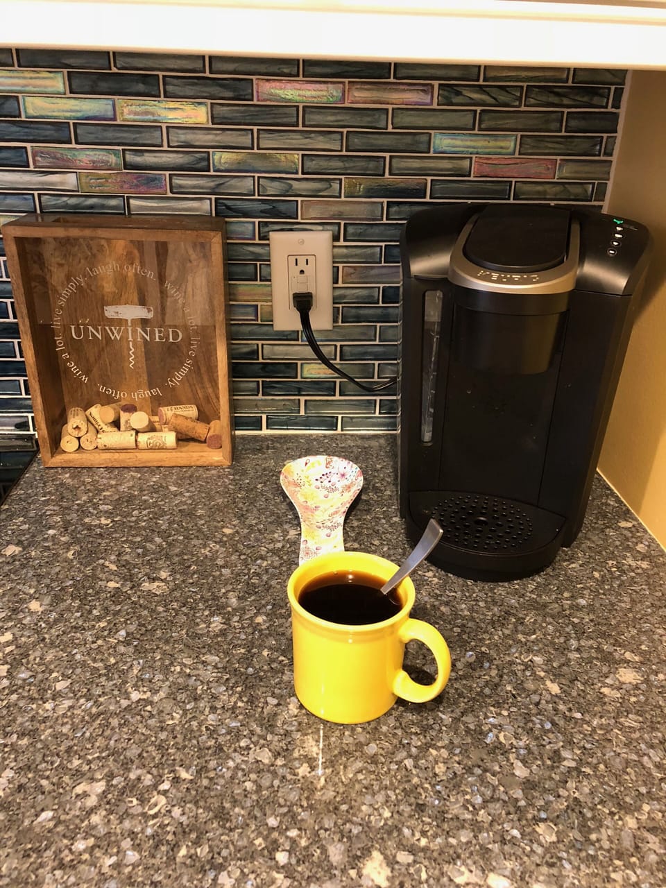 Coffee lovers will enjoy a Keurig, & a Mr. Coffee is also found above the frig.