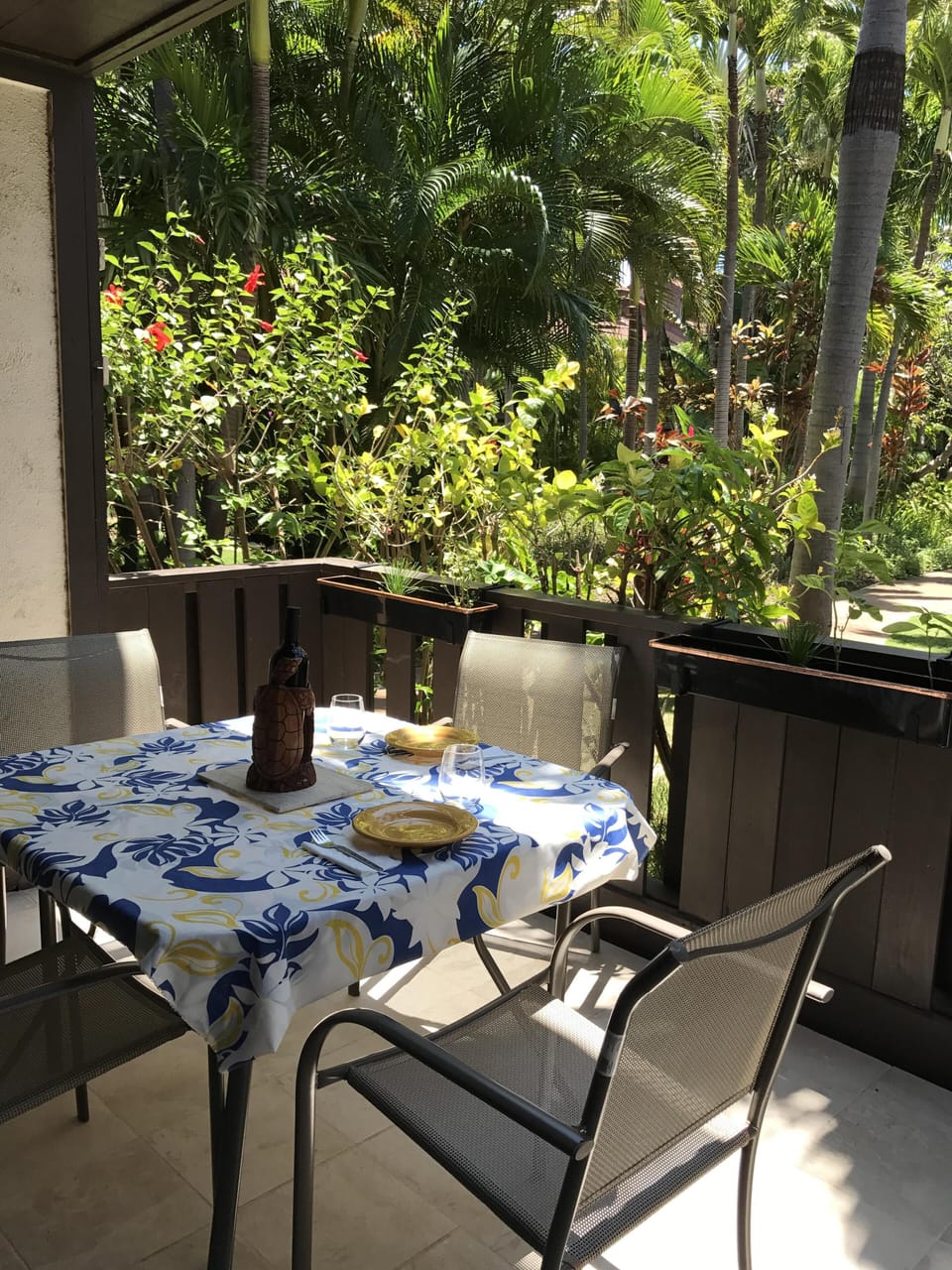 Spacious lanai looks out on lush gardens